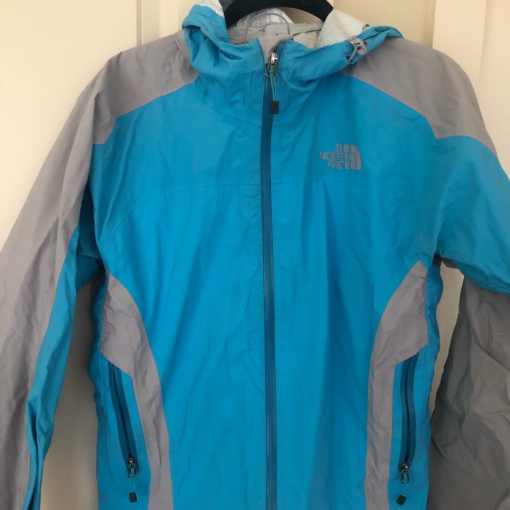 Bright blue north face rain coat